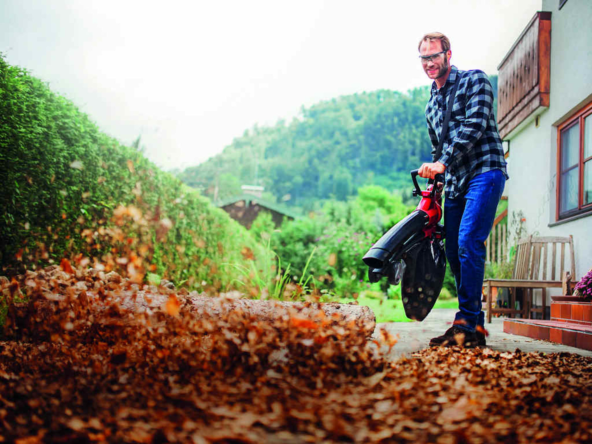 A man is using a Leaf Vacuum